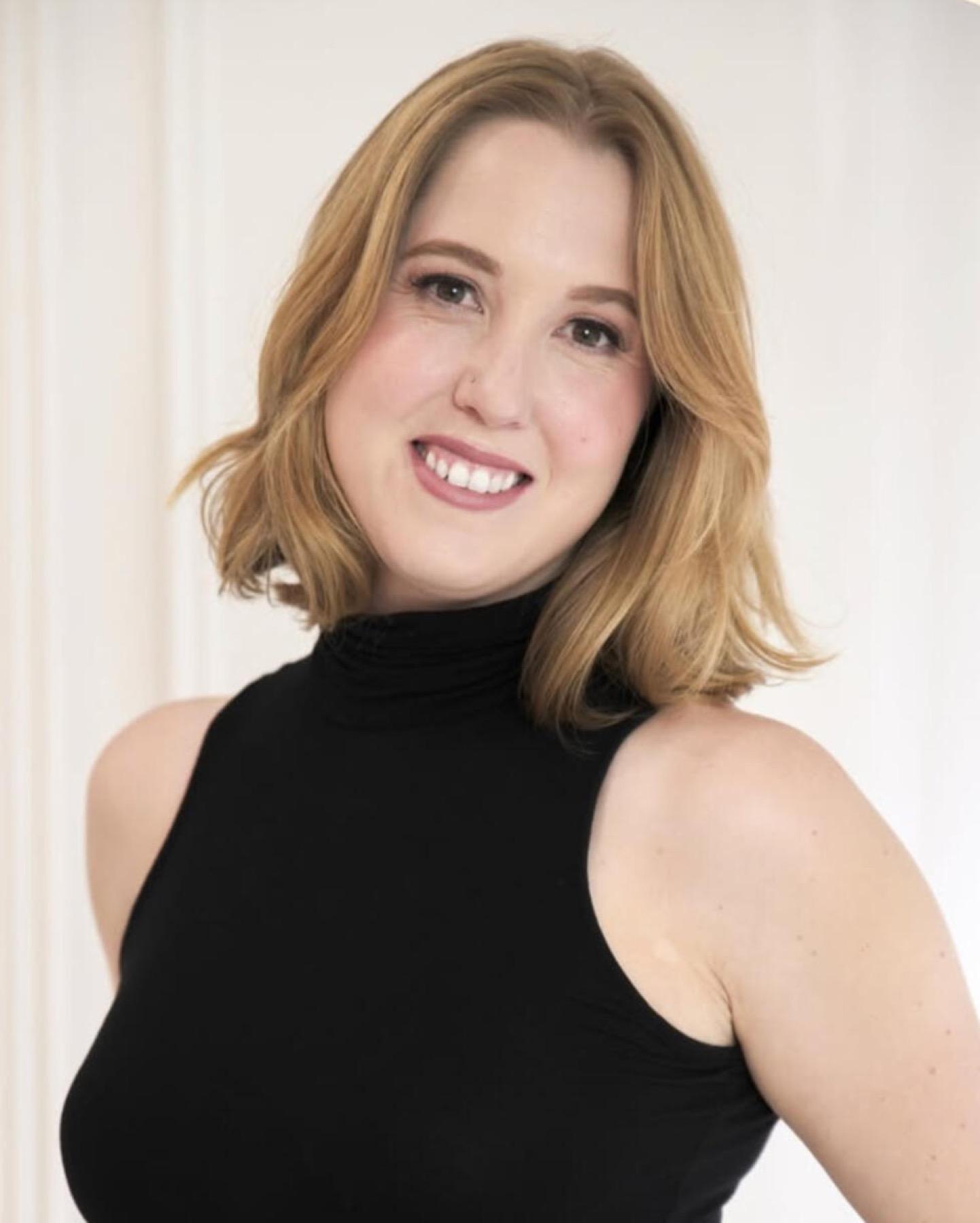 Professional headshot of Rebecca Lyons against a soft white background