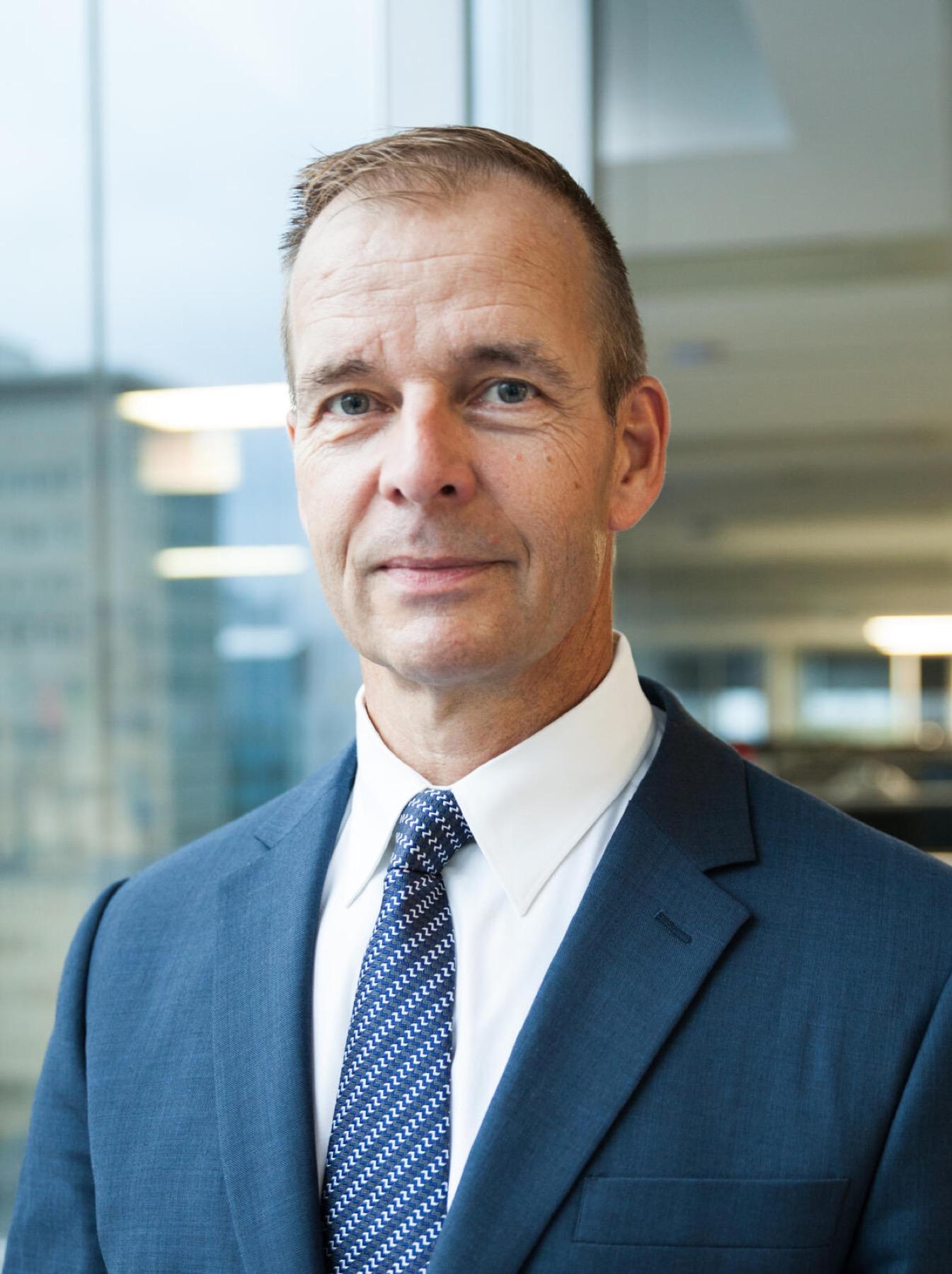 Tom Mikkelssen, Scientific Director of the Ontario Brain Institute, photographed beside an office window